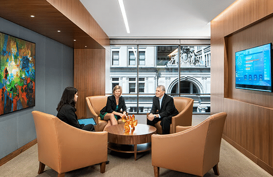 People conversing in a modern office