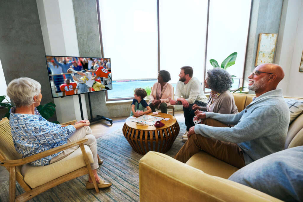 People in a waiting room watching TV